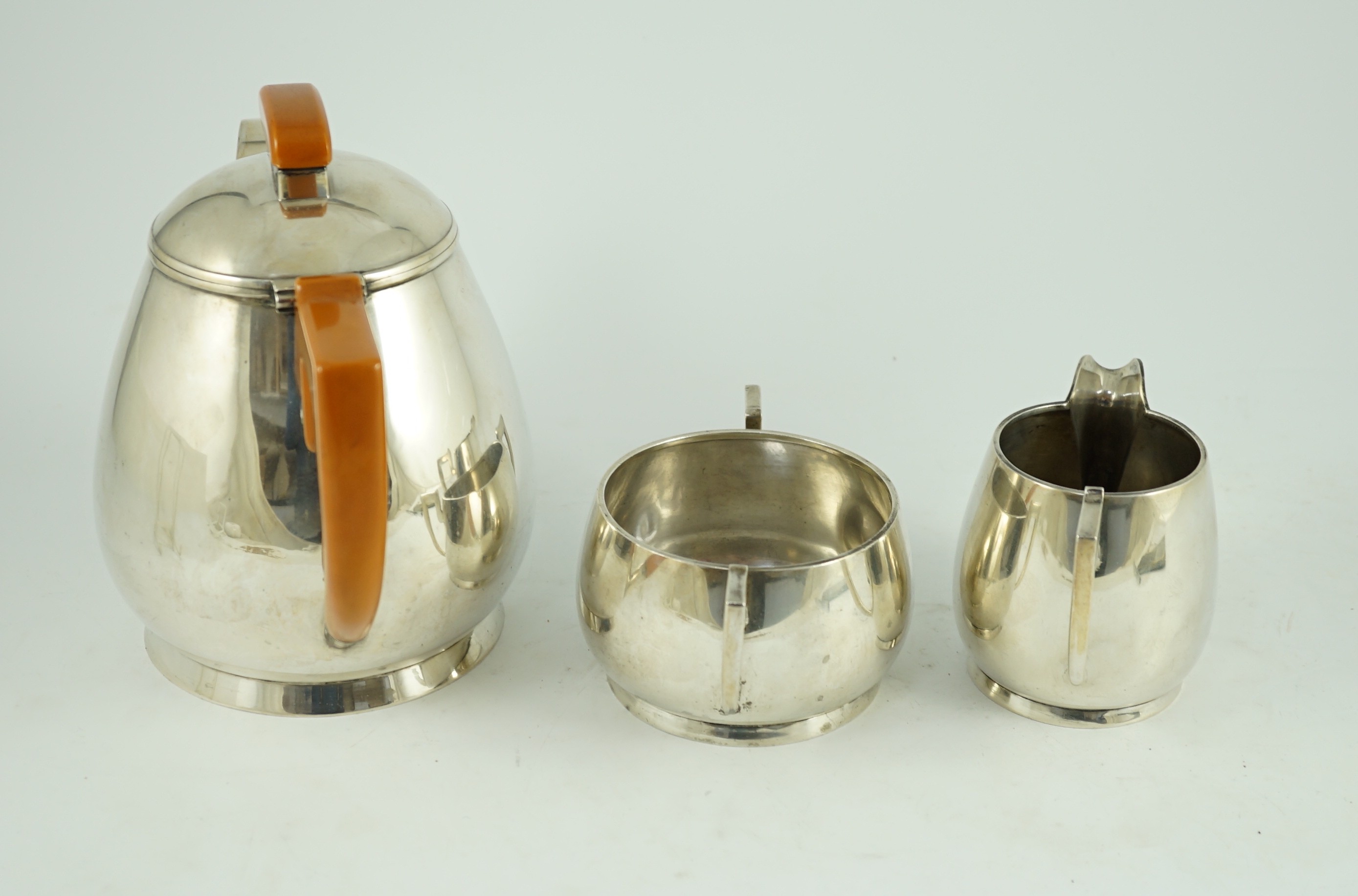 A stylish George VI silver three piece tea set, by Ls Sl